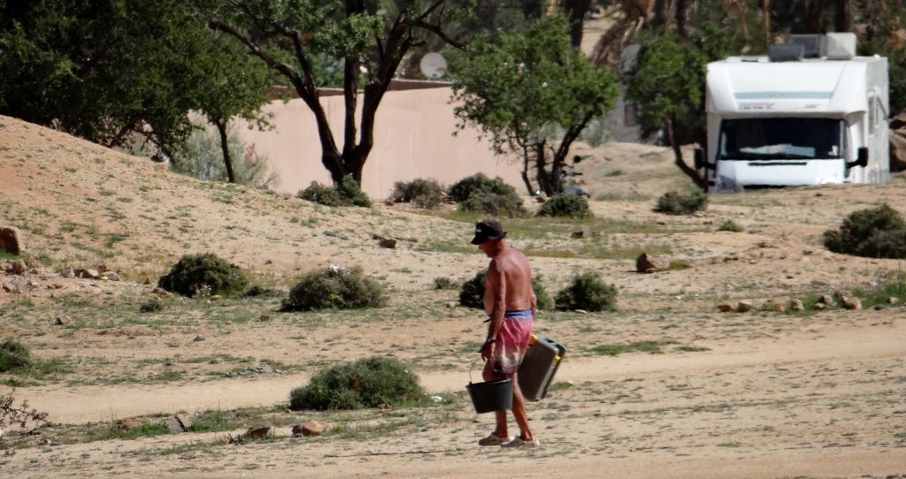 Despite there being no facility for black waste treatment here, folks are just piling it up behind some rubble next to the site. Shameful.