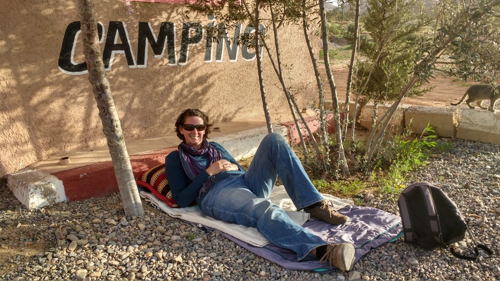 Ju got a job! While Omar, the campsite manager and cook, went into town to get supplies for our lamb tagine, she took charge of the site, which mainly involves lying here in the shade.