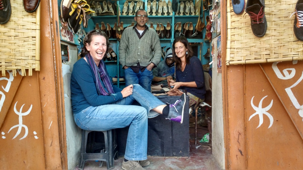 Ju getting her hand-made boots. The lady in the shop is French, and is learning how to make shoes