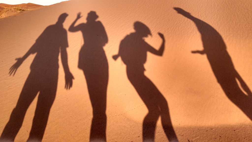 I **think** Phil is pretending a hold us up with a gun?