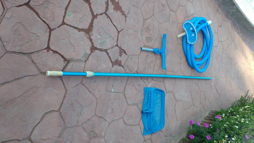 We got together all the bits and bobs for the pool hoover, worked out where it plugged into the pool and got started!