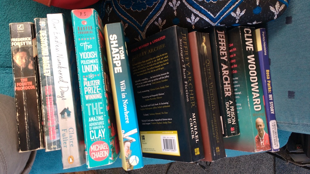 Books! They've got English books here! Yes, we have a ton of 'em on the Kindle but a real book is great to read. Yes, I am setting you up for the next photo.