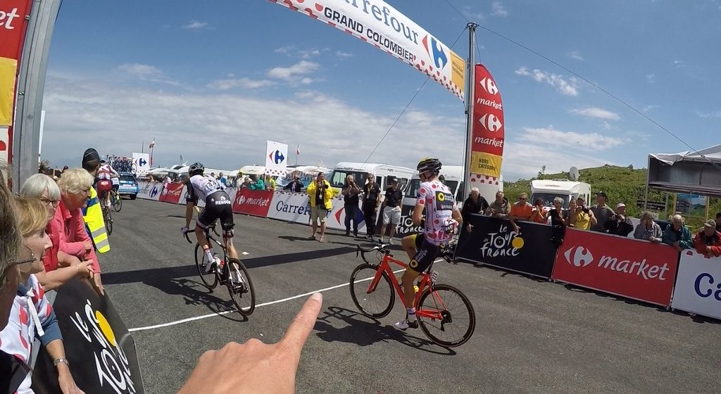 King of the Mountains, doing us shirt up for a fast, long and cold descent. Some riders stuffed newspaper down their shirts