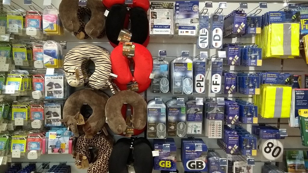 Buy your driving-legal-abroad stuff before the ferry, where they'll rob you blind!