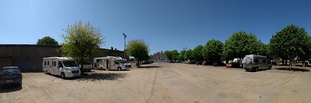 The free motorhome aire at Bonneval. We're tucked back towards the wall to avoid the tree scraping on the roof above where we sleep if the wind picks up.