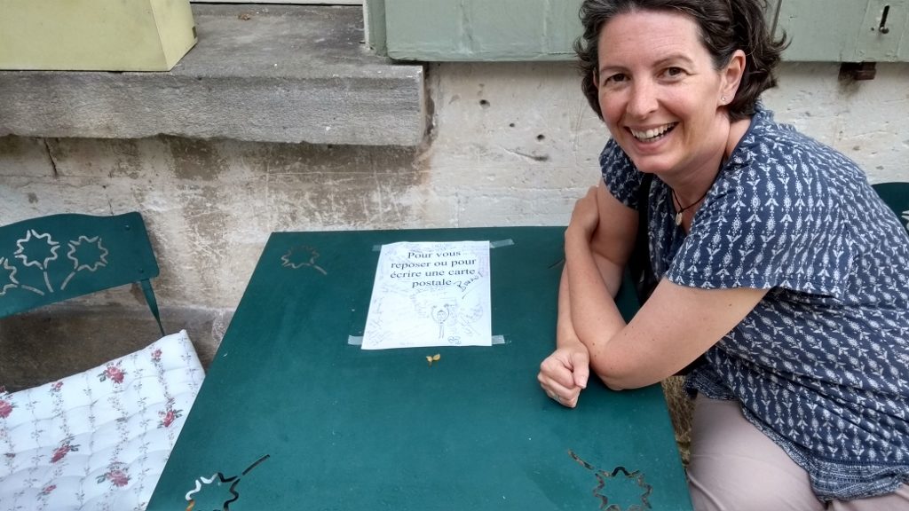 A table and chairs kindly placed out on the street for you to rest, or write a post card.