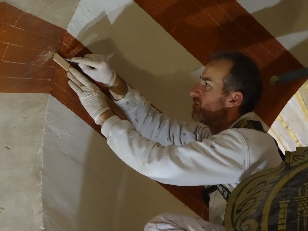 Workman Drawing False Brick Lines on an Arch in the Mezquita Cordoba