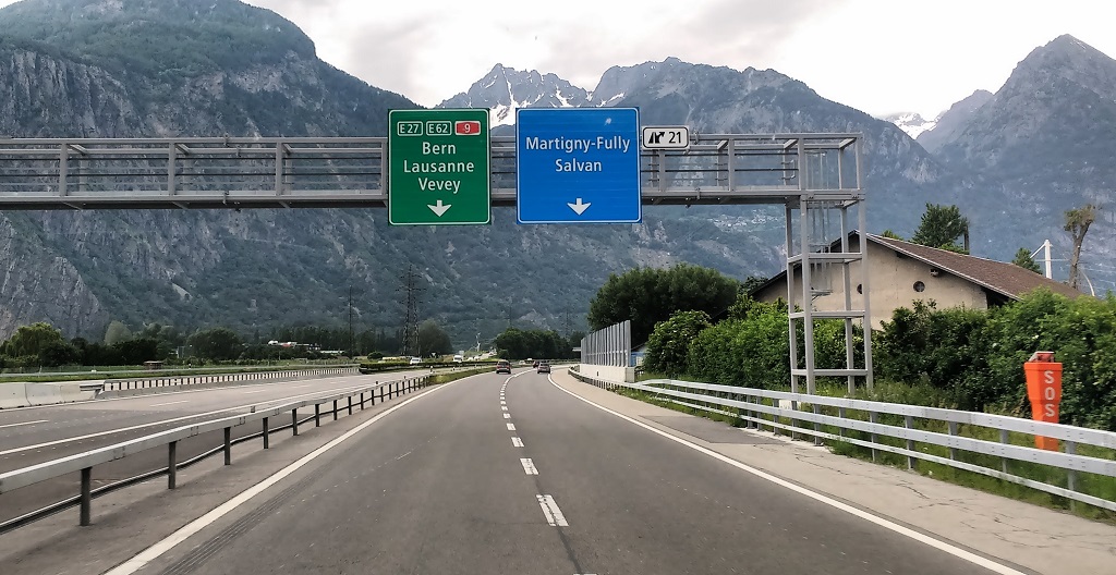 Green motorway sign Bern Lausanne Vevey Switzerland