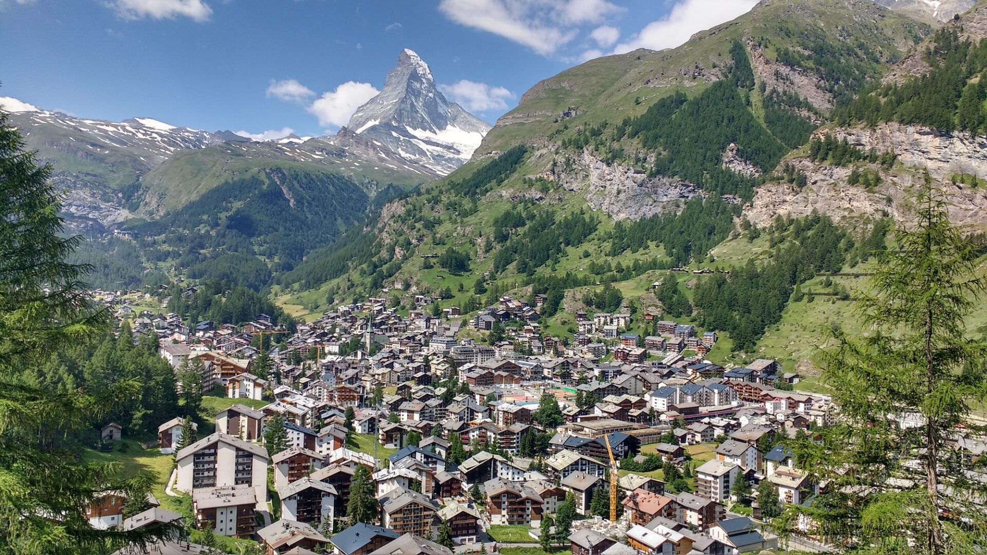 Zermatt quick shrinking as you ascend, the 'Toblerone' Matterhorn stands massive in the background