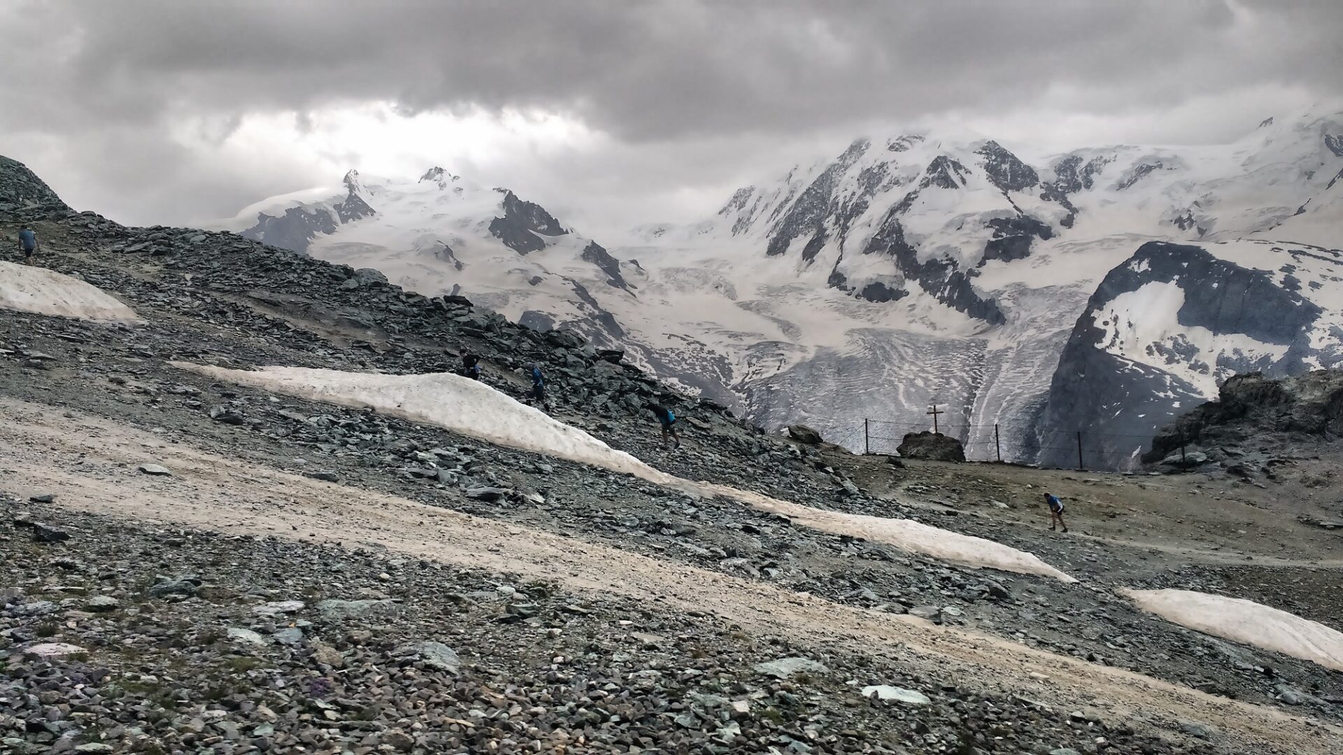 Ultra runners rendered tiny by the epic scenery surrounding Gornergrat