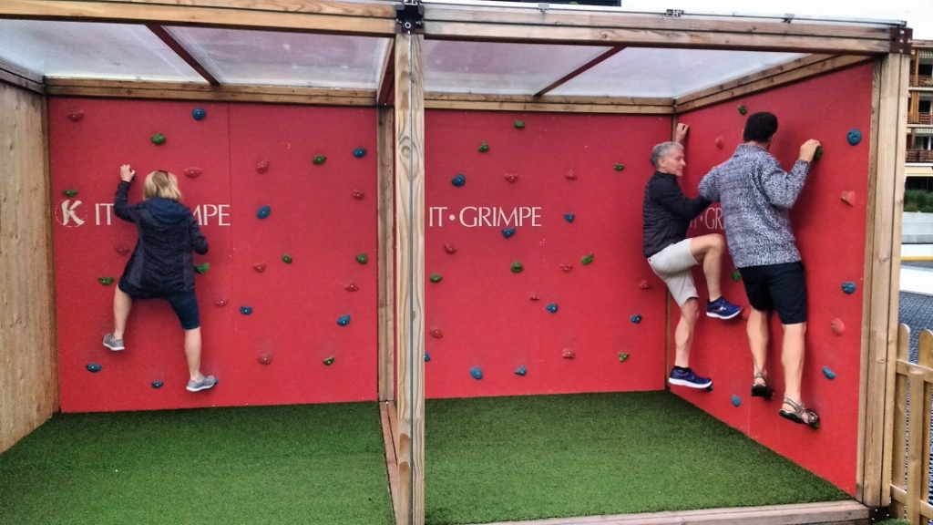 Adults on climbing wall