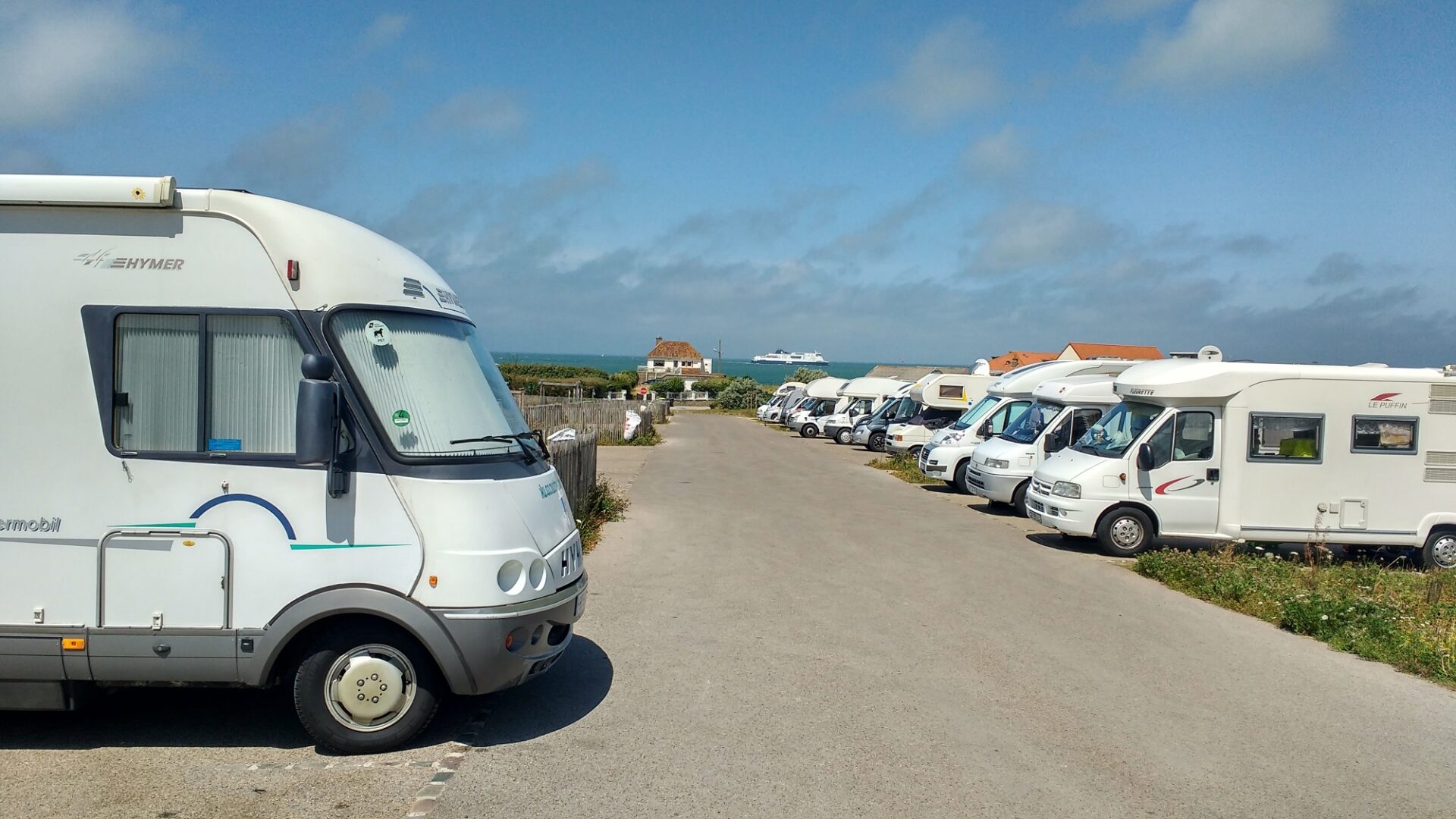 Motorhome parking at Sangatte, with ferries flowing past in the background