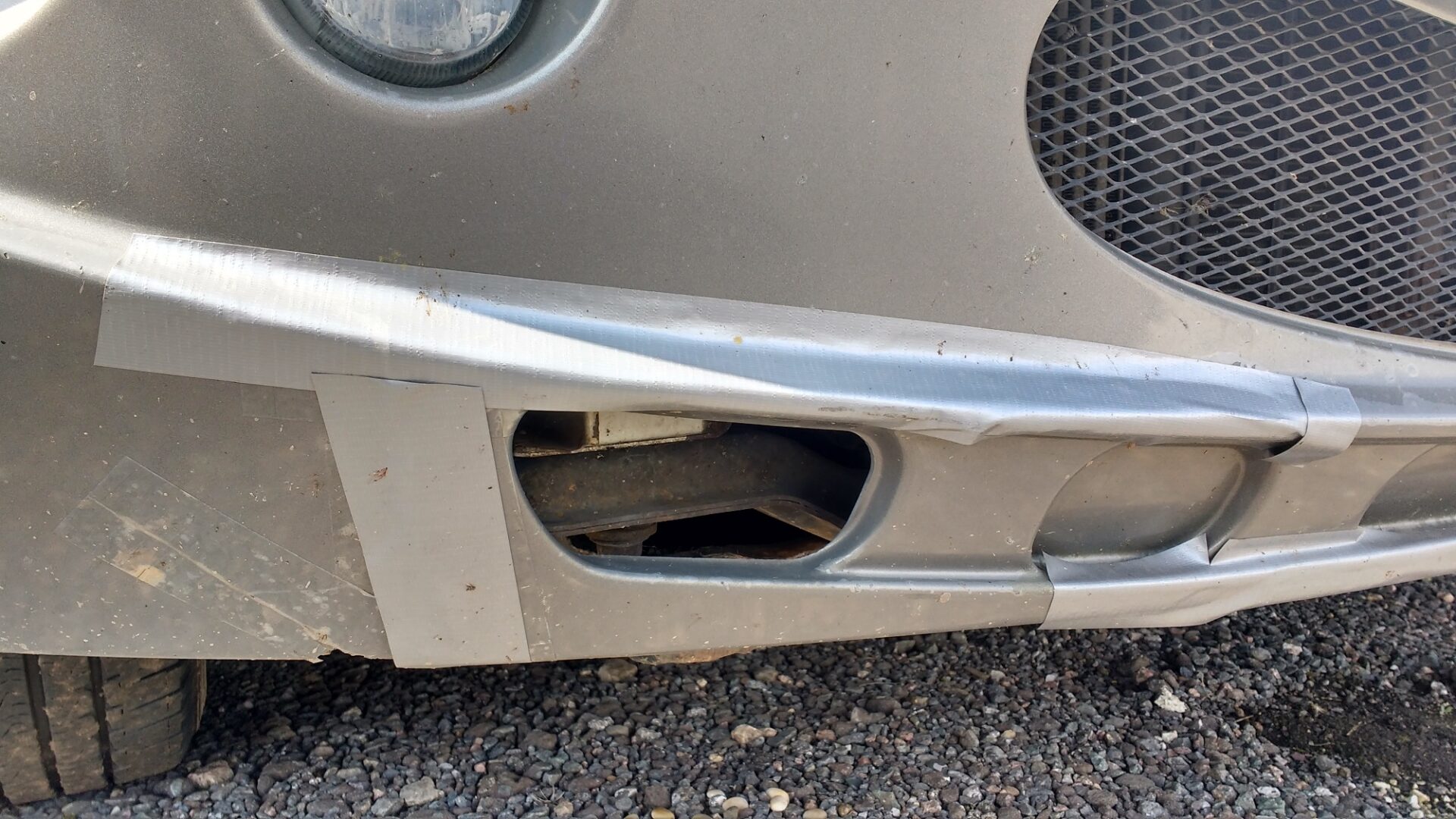 cracks in a motorhome bumper held tgether with gaffa tape