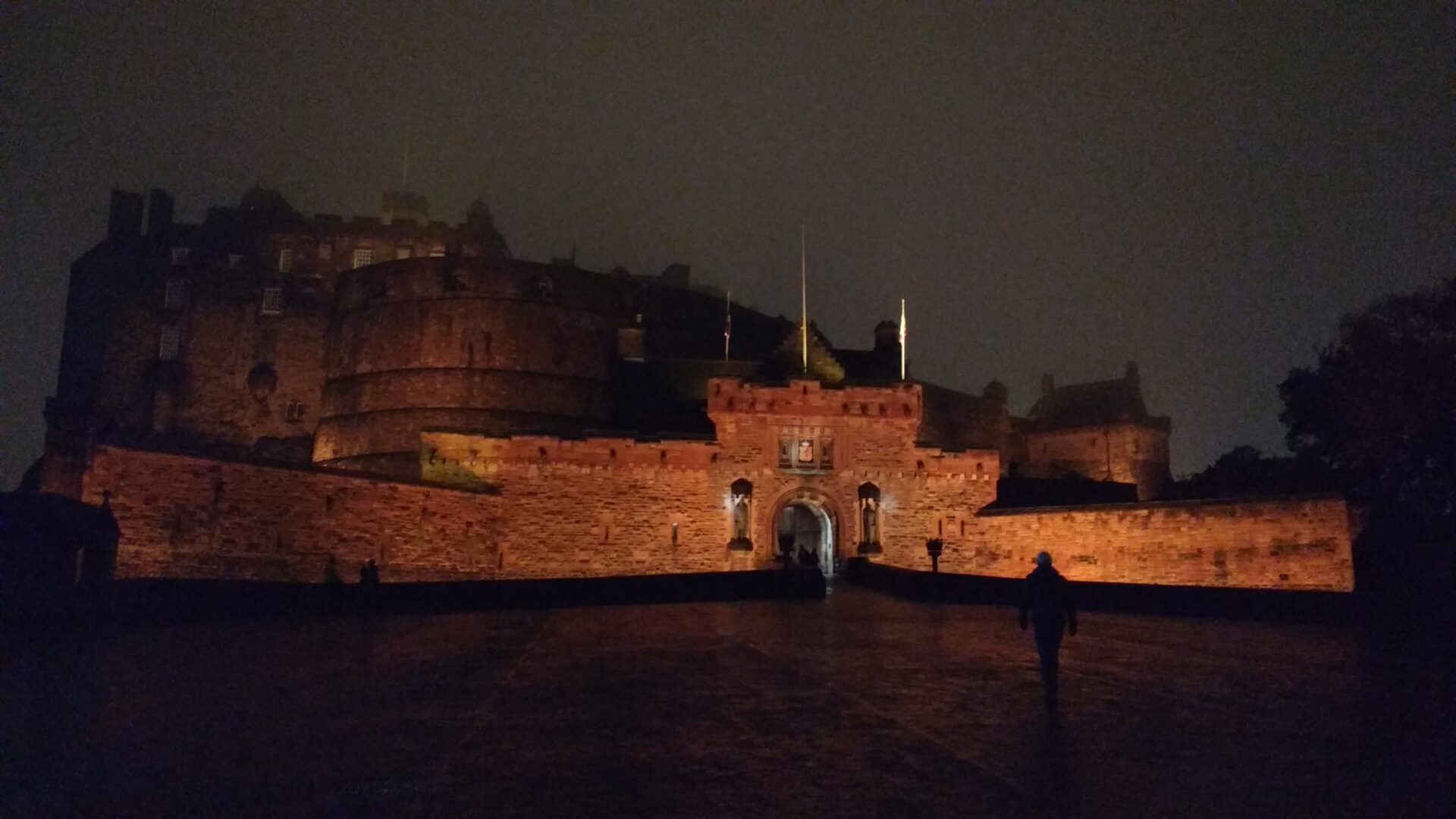 Edinburgh Castle by night, stood high on volcanic rock above the city