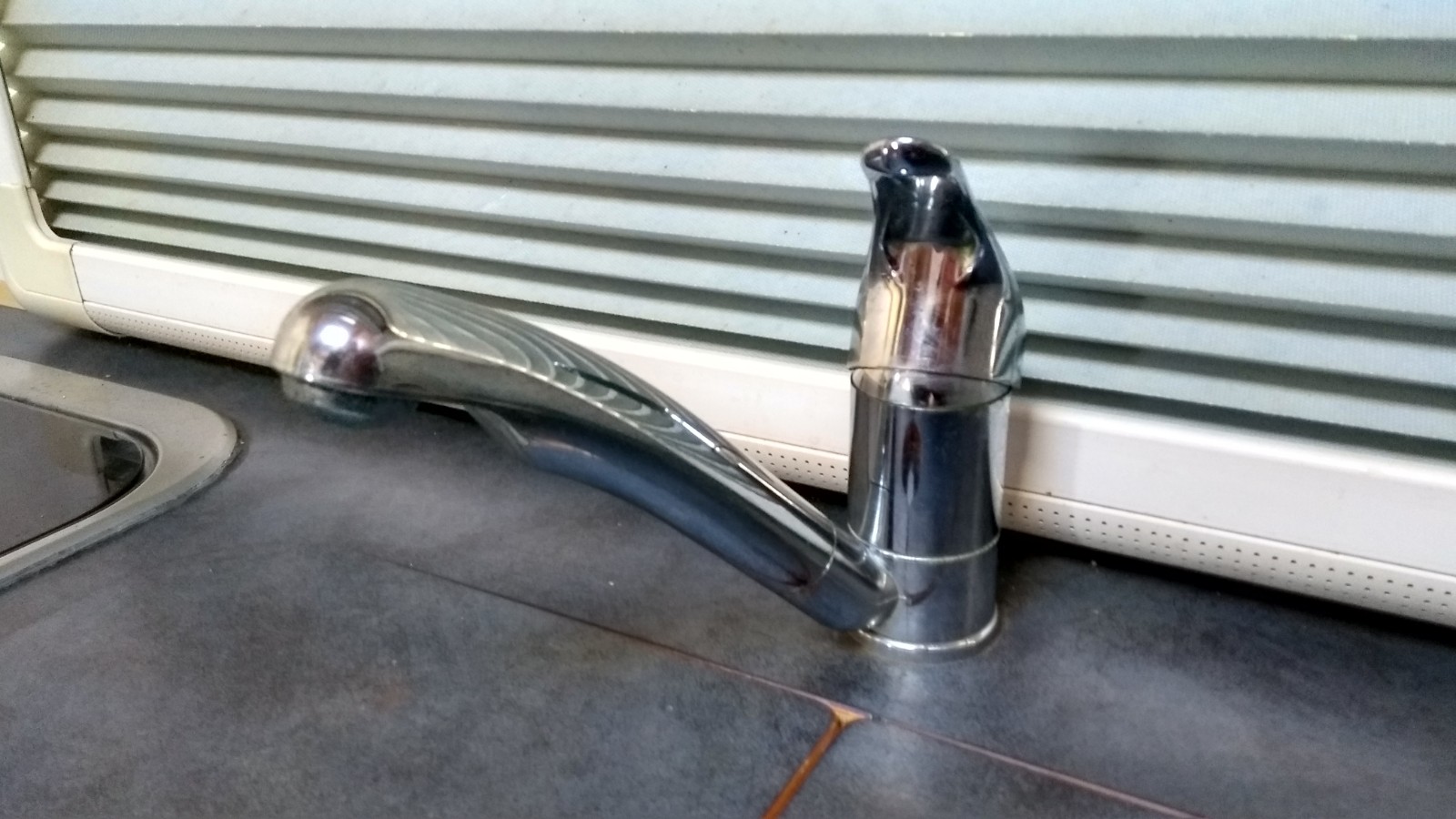 Opening our motorhome taps to drain the water pipes for winter