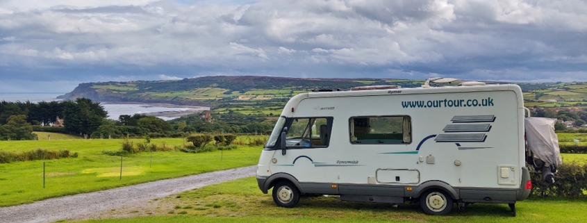 Motorhome at campsite overlooking Robin Hoods Bay