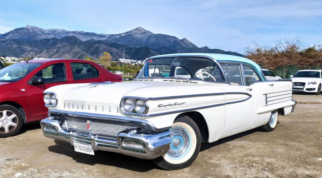 Funky old car spotted in the nearby beach parking, with the peaks of Almendron and El Cielo in the background