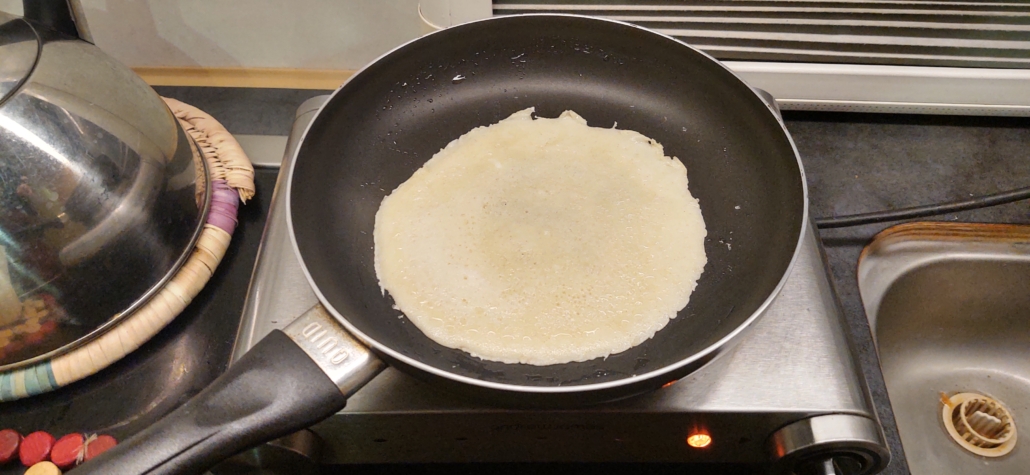 Cooking pancakes on a hotplate in a motorhome.