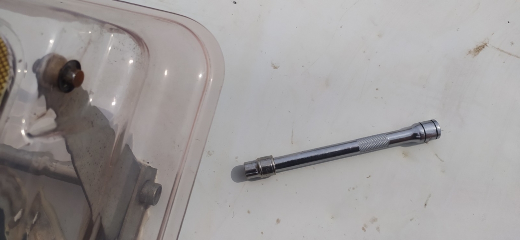 One of the starlock washers pushed back on, with the improvised tool made from a socket and extension bar