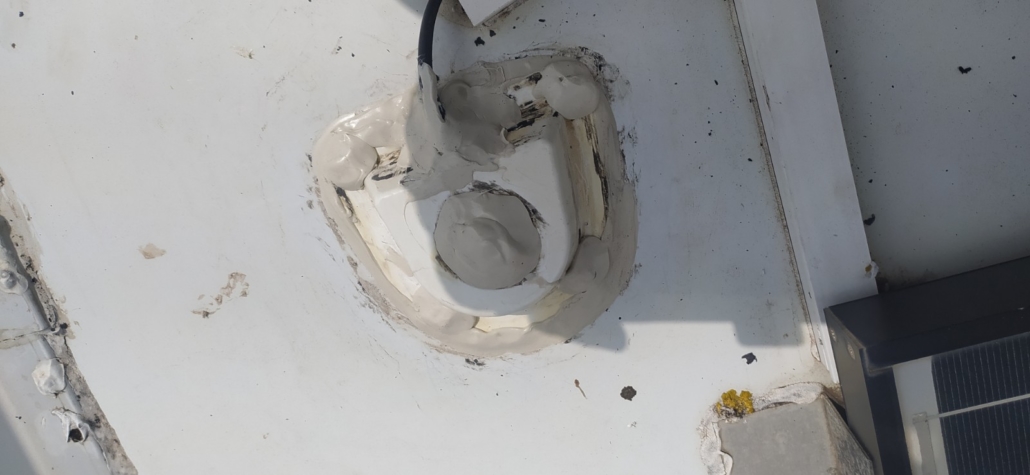 The solar panel gland on our motorhome roof, resealed again, this time it's watertight!