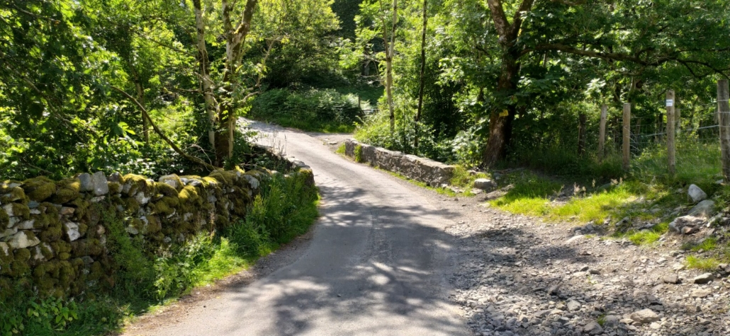 The narrow bridge crossing on the road to Seathwaite Farm Campsite near Keswick