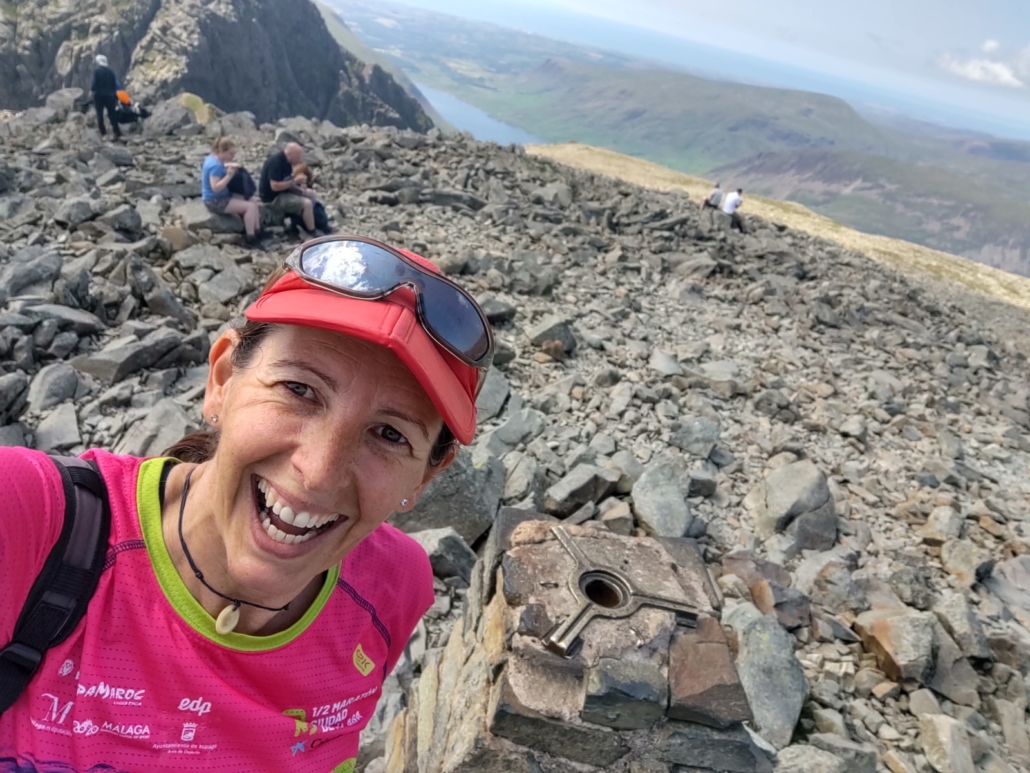 Ju at the trig point on the top of Scafell Pike, 978m above sea level