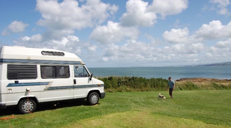 A panel van camper van overlooking the sea on Angelsey, Wales