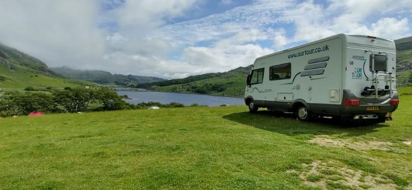 Our motorhome on a farm site in Cumbria in summer, a good location to use the SolarSaga panels (unless it rains)
