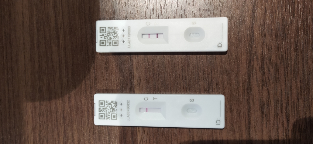 Ju's postive COVID-19 Lateral Flow Test (top)