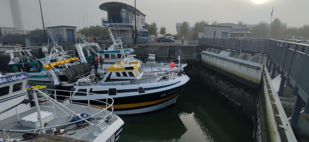 Fishing boats waiting to enter Honfleur's bassins via a huge lock at the entrance to the sea