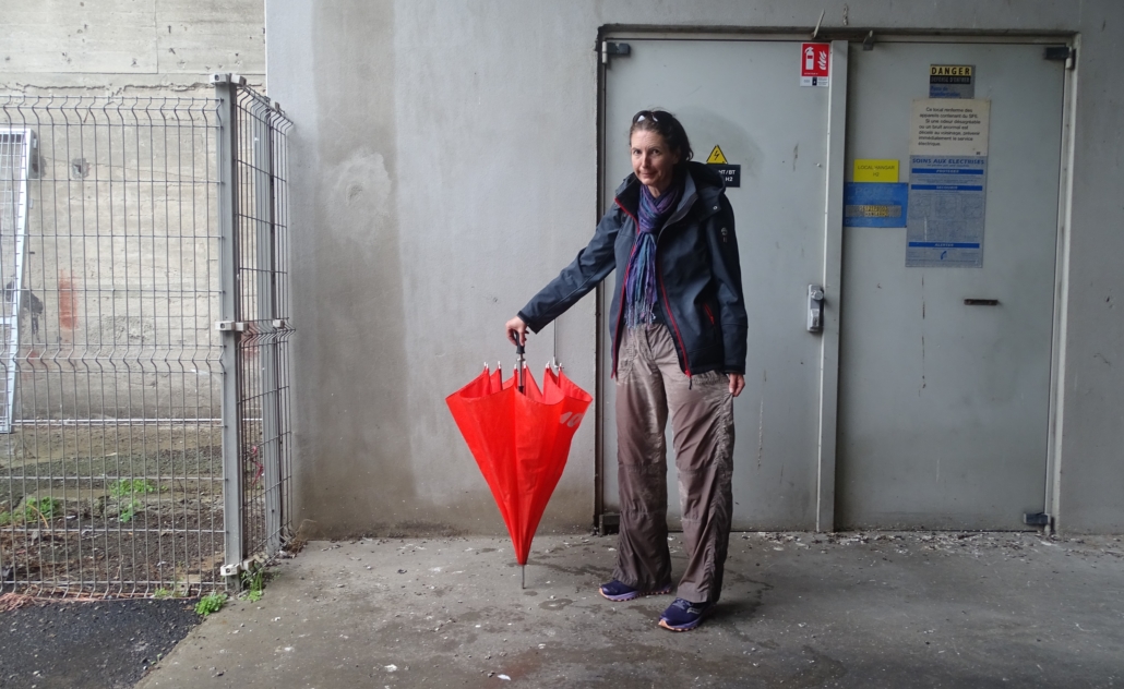 It absolutely lashed it down on us at one point! Here's Ju, hiding from the downpour under Keroman 1