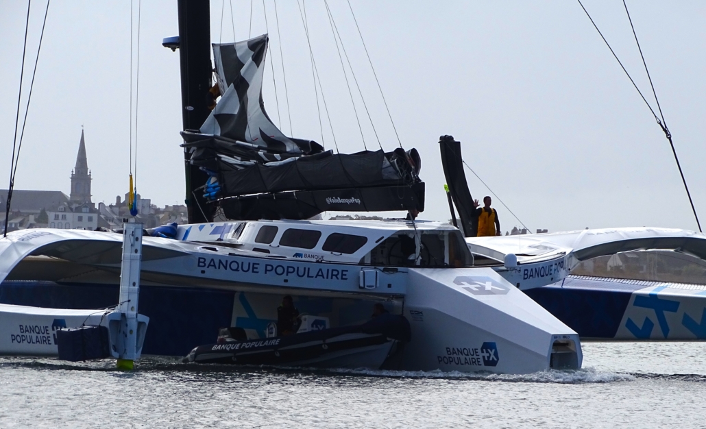 The Banque Populaire XI being towed backwards. As far as I can tell, this thing is built to break world records. It looks very, very expensive.
