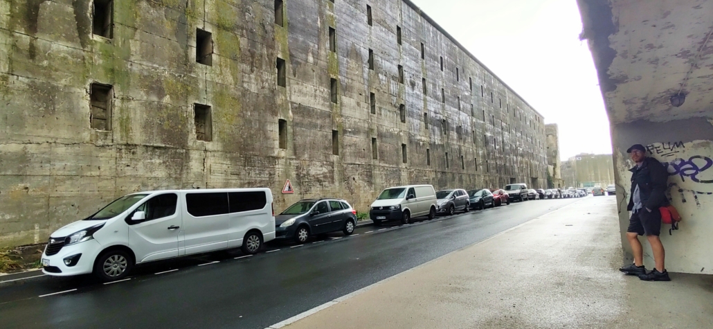 Hiding in the rain opposite the wall of Lorient sub pen K4, the only part completed