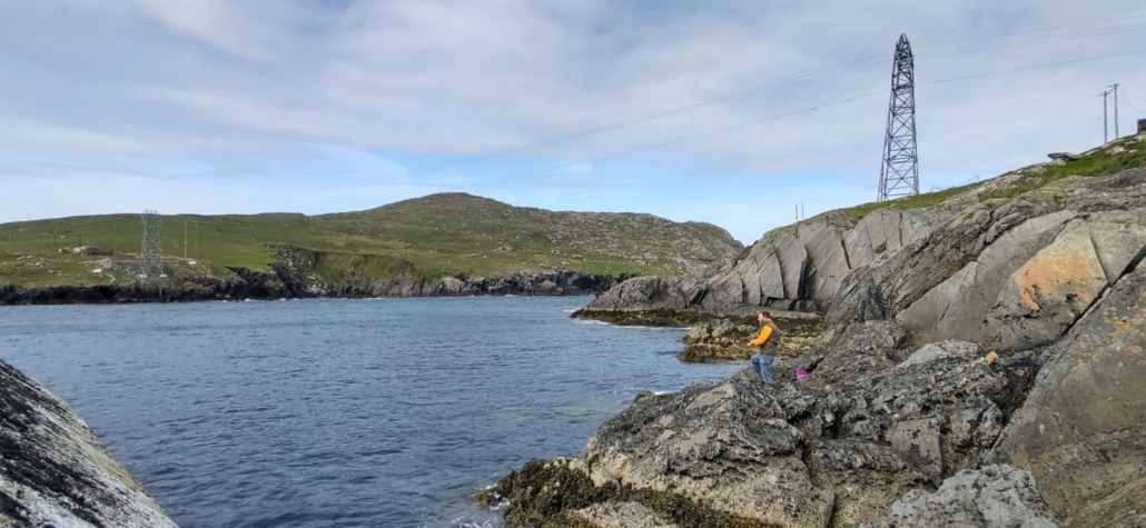 Man fishing on rocks