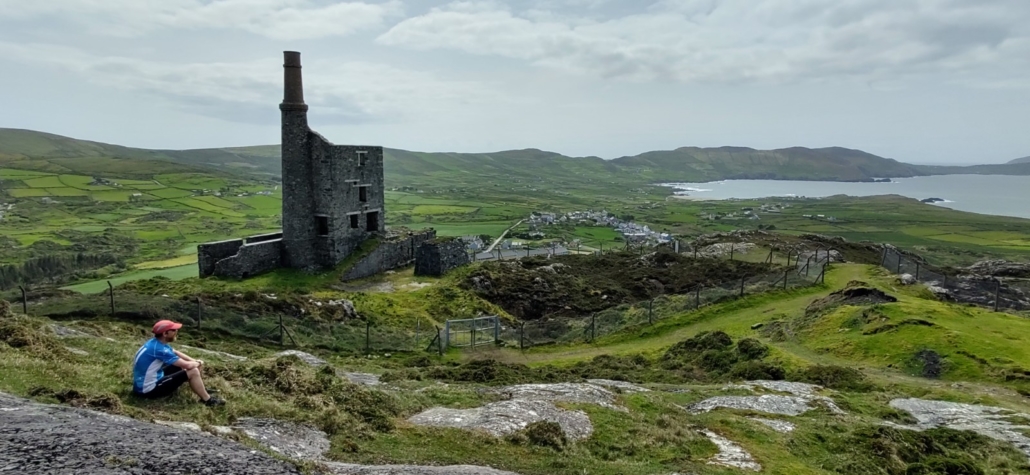 runner sitting my ruined copper mine engine house with views down to coast