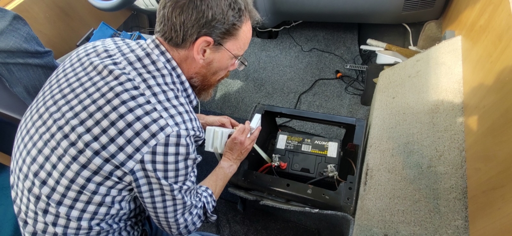 The egg-smelly leisure battery, which is now out of the van