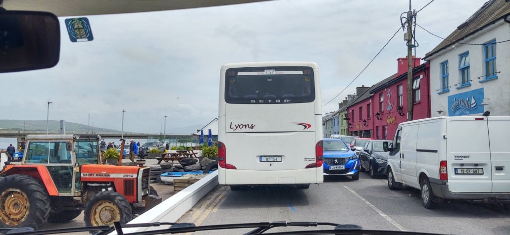 bus and cars in small village