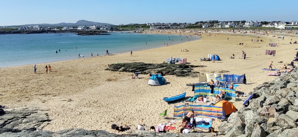Families enjoying a sunny day at Trearddur Bay, Anglesey