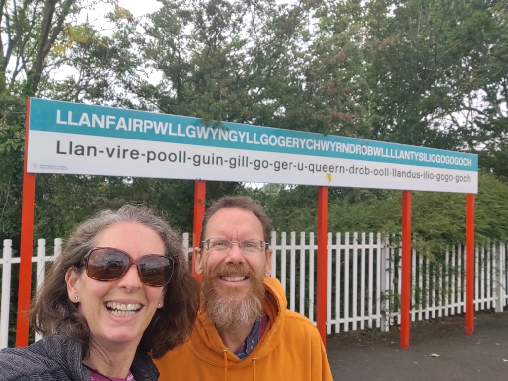 Llanfairpwllgwyngyllgogerychwyrndrobwllllantysiliogogogoch Europe's longest place name train station sign Anglesey Wales