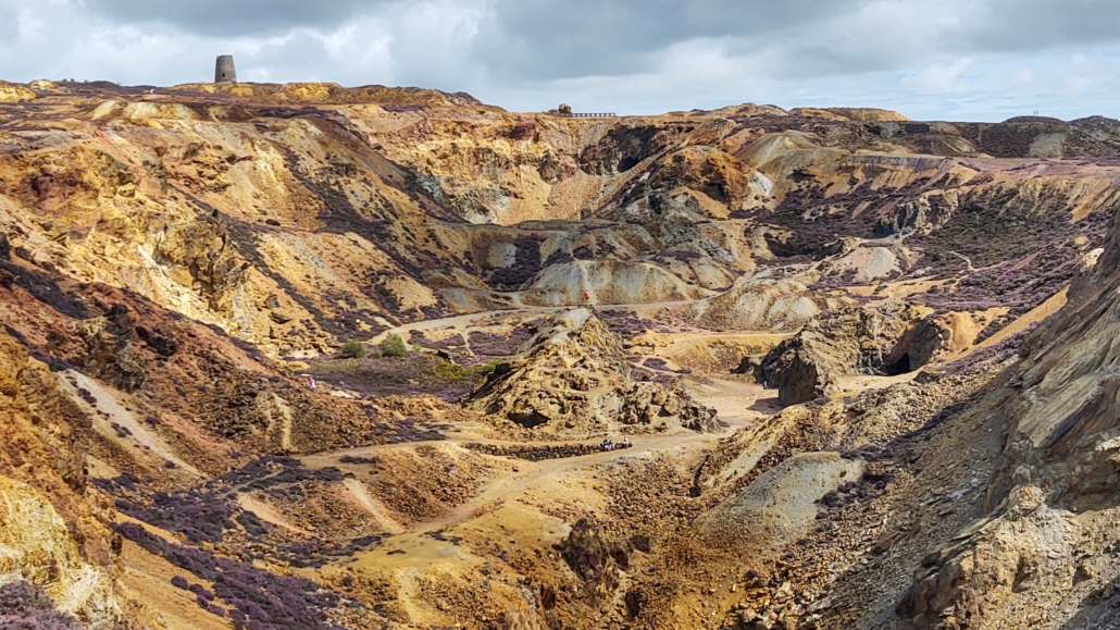 The tiny bridge at the top gives some idea of scale of this, one half of the opencast at Parys Mountain