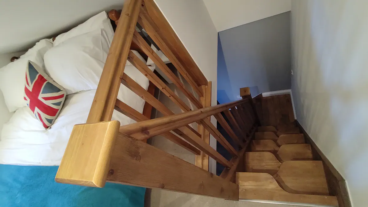 Space-saving stairs to the mezzanine in the Kimberley Hideaway, AirBnB Nottingham