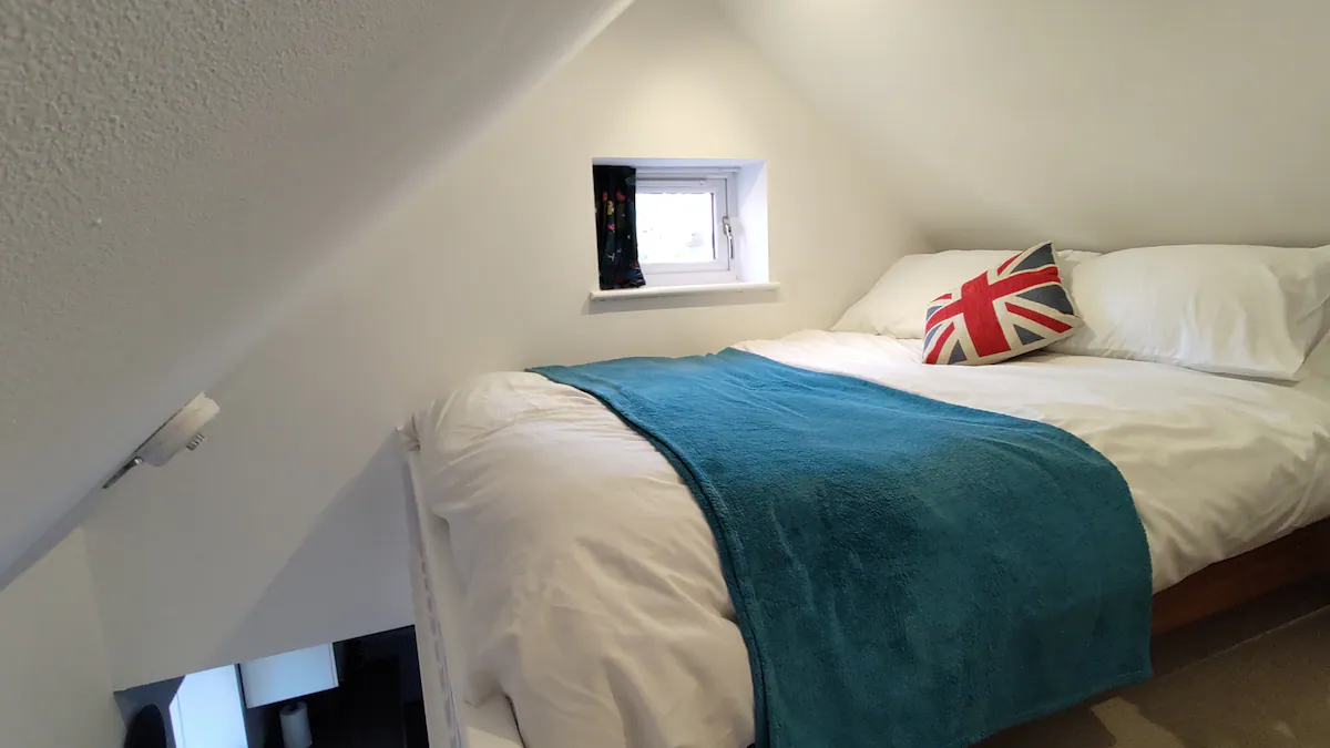 Double bed on a mezzanine in the Kimberley Hideaway, AirBnB Nottingham