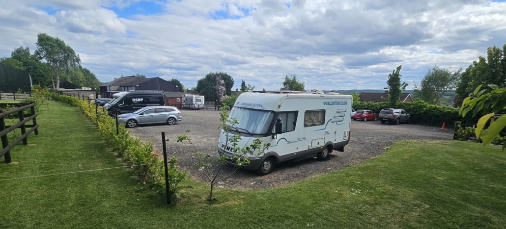Motorhome in large gravel car park