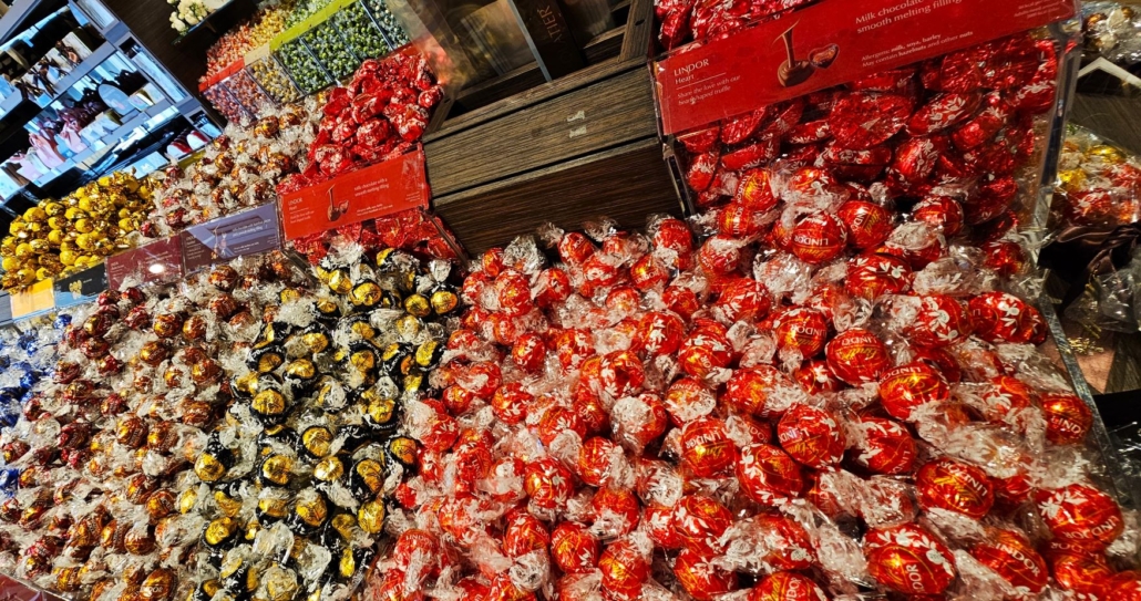 Loads of Lindt chocolates in brightly coloured wrappers