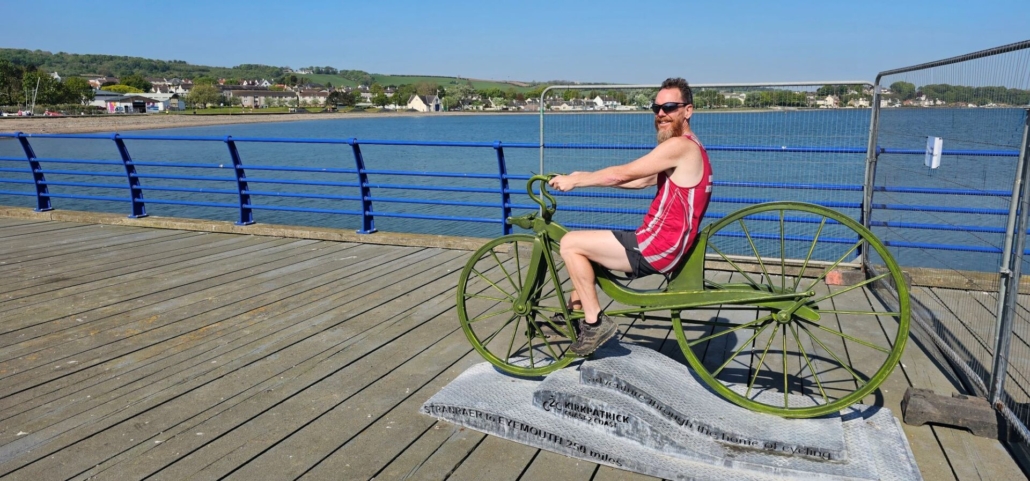 Jay on statue of a bicycle