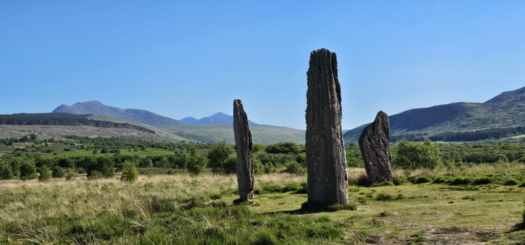 Three large standing stones in a field at Machrie Moor