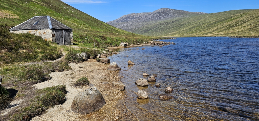 Loch Iorsa - lake surrounded by hills with small boating hut