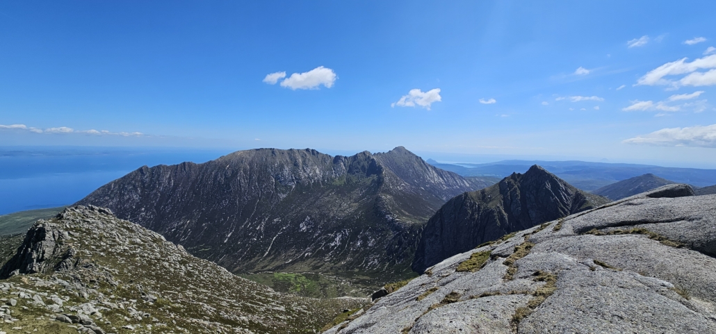 Views of hills and sea from top of a hill