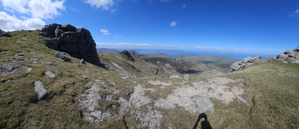 Views of hills and sea from top of a hill