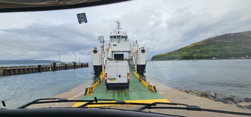 Van driving onto a ferry
